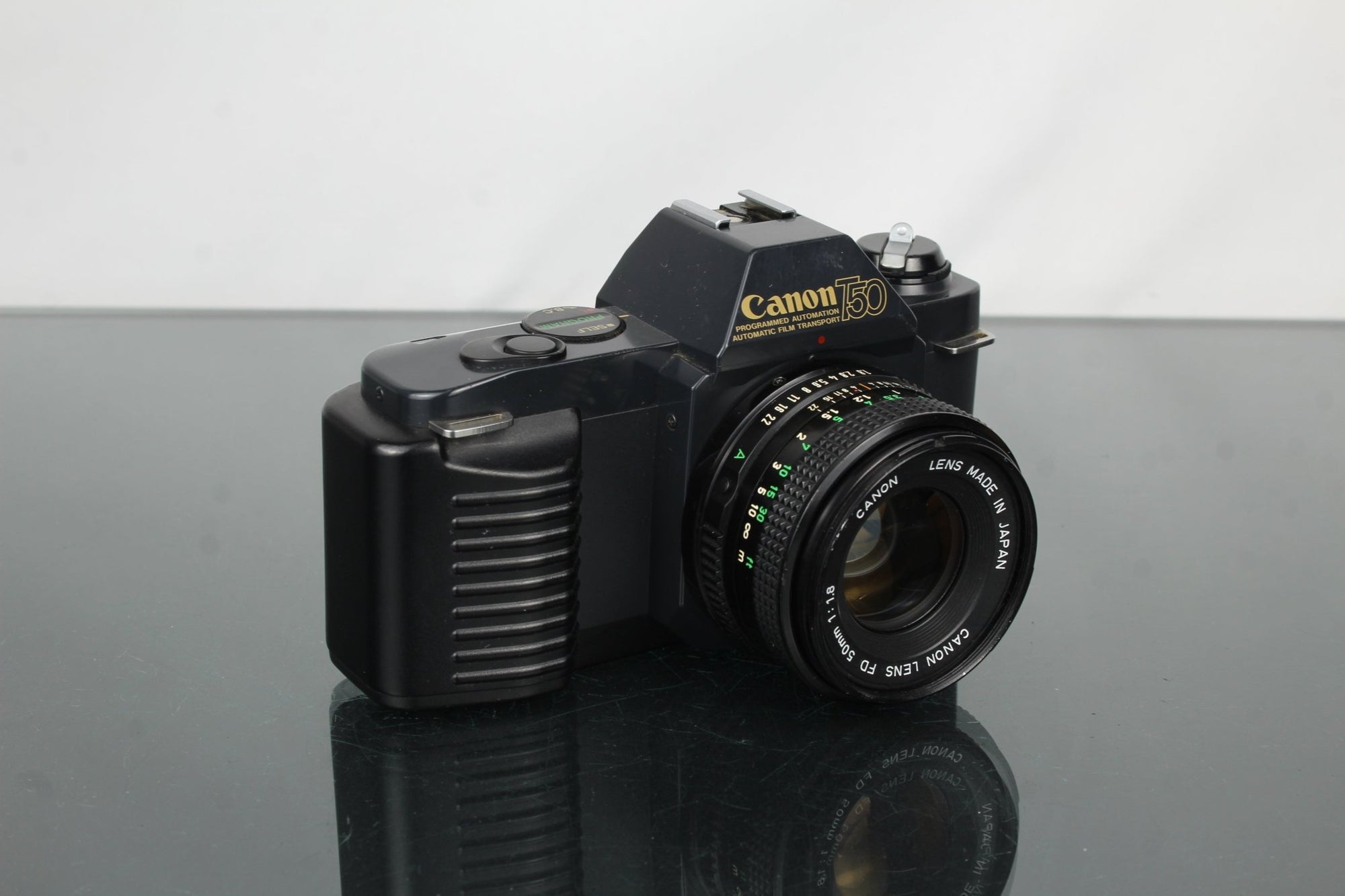 Canon T50 + 50mm 1.8 Canon FD lens - Dutch|Thrift